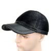 Baseball cap with earflaps, faux leather texture, visible stitching detail. Dark brown color, cozy design for cold weather. -