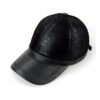 Baseball cap with earflaps, faux leather texture, visible stitching detail. Dark brown color, cozy design for cold weather. -
