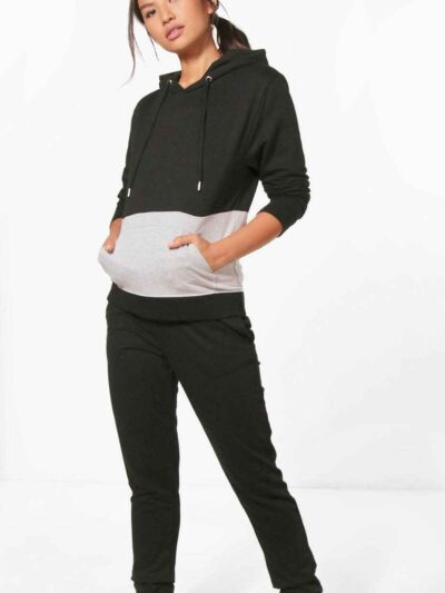 Paneled pullover hooded tracksuit. Soft fleece fabric. Accented stitching, drawstring hood. Relaxed fit, versatile athletic w
