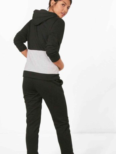 Paneled pullover hooded tracksuit. Soft fleece fabric. Accented stitching, drawstring hood. Relaxed fit, versatile athletic w