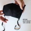Reusable face mask, soft fabric, visible stitching detail. Breathable medical-style mask, adjustable ear loops for snug fit.