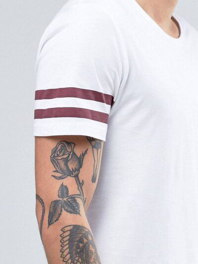 Close-up of blank, custom-printed t-shirts. Notice soft, cotton blend fabric and durable double-needle stitching. Vibrant col