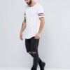 Close-up of blank, custom-printed t-shirts. Notice soft, cotton blend fabric and durable double-needle stitching. Vibrant col