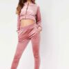 Cropped pink velour tracksuit. Heavyweight fabric, visible plush texture. Luxurious winter set with detailed stitching and a