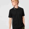 Close-up of a blank polo shirt. Smooth pique knit, clean stitching. Ready for printing, embroidery. Available in various colo