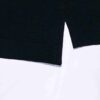 Close-up of a plain polo shirt. Soft, pique knit texture, clean stitching. Available in bulk for custom printing projects. -