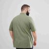 Plus size polo shirt, premium cotton pique knit. Clean, tailored fit, subtle texture. Note reinforced stitching at collar. So