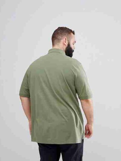 Plus size polo shirt, premium cotton pique knit. Clean, tailored fit, subtle texture. Note reinforced stitching at collar. So