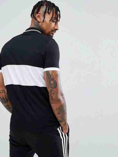 Close-up of a textured poly-cotton polo shirt, showing fine stitching and a subtle sheen. A comfortable and customizable garm