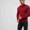 Close-up: Premium polo shirt. Fine knit texture, impeccable stitching, subtle heather blue color. High-quality casual wear. -