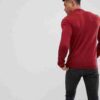 Close-up: Premium polo shirt. Fine knit texture, impeccable stitching, subtle heather blue color. High-quality casual wear. -