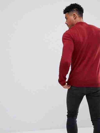 Close-up: Premium polo shirt. Fine knit texture, impeccable stitching, subtle heather blue color. High-quality casual wear. -