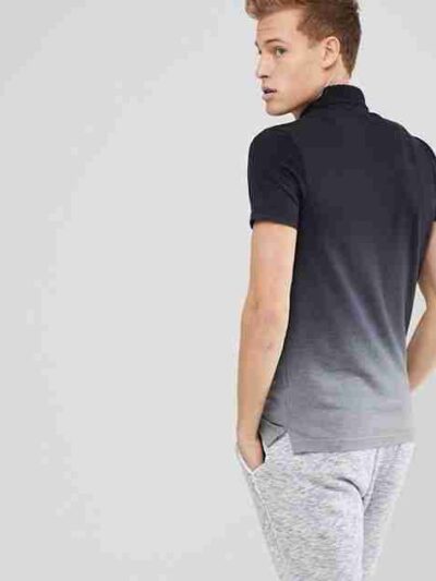 Close-up of a polo shirt, embroidered logo detail. Soft, fine knit fabric texture. High-quality stitching visible. Premium fe