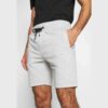 Acid wash men's short set. Textured cotton knit, visible stitching detail. Relaxed fit, grey/black tones. Streetwear style. -