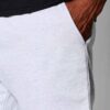 Lightweight gym shorts in heather grey; breathable mesh panels enhance ventilation. Close-up shows fine stitching detail and