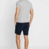 Men's street fashion short set: crisp, lightweight fabric with subtle textured weave. Clean stitching, modern fit. Relaxed, u