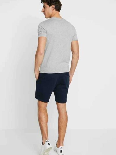 Men's street fashion short set: crisp, lightweight fabric with subtle textured weave. Clean stitching, modern fit. Relaxed, u