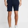 Men's street fashion short set: crisp, lightweight fabric with subtle textured weave. Clean stitching, modern fit. Relaxed, u