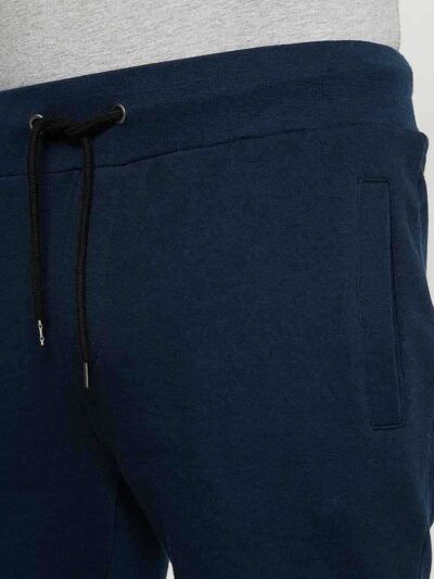 Men's street fashion short set: crisp, lightweight fabric with subtle textured weave. Clean stitching, modern fit. Relaxed, u