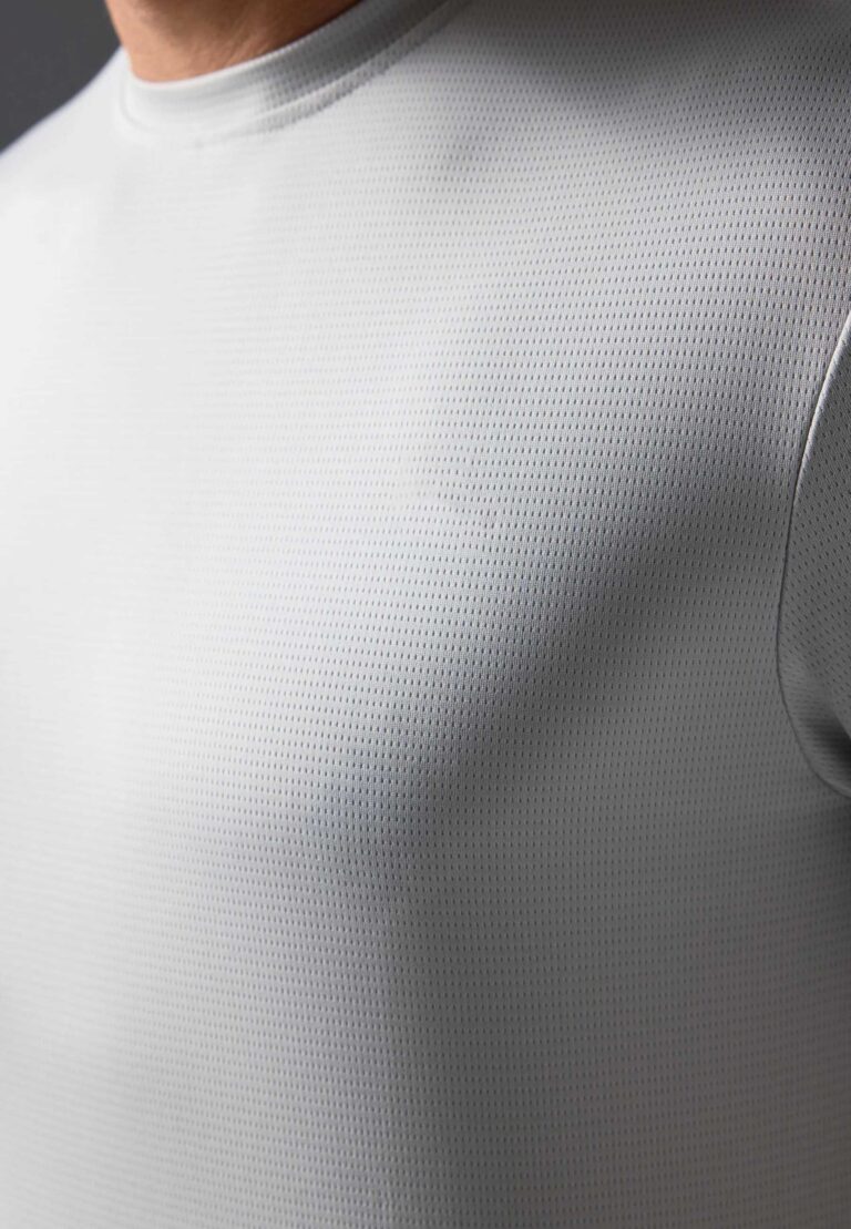 Men's two-piece short set. Textured, lightweight fabric, likely cotton blend. Matching top and shorts. Sharp, visible stitchi