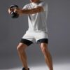 Men's two-piece short set. Textured, lightweight fabric, likely cotton blend. Matching top and shorts. Sharp, visible stitchi