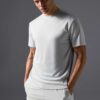 Men's two-piece short set. Textured, lightweight fabric, likely cotton blend. Matching top and shorts. Sharp, visible stitchi