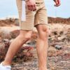 Close-up of custom workout shorts. Breathable fabric, reinforced stitching, subtle logo placement. Performance activewear, da