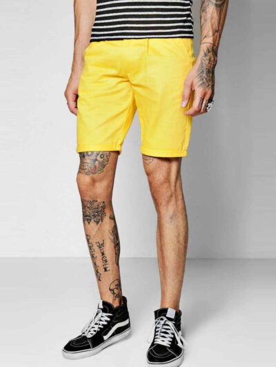 Recycled fabric shorts, close-up showing textured weave, neat stitching. Green hue hints at eco-friendly material. Sustainabl