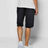 Close-up of soft French Terry gym shorts. Note loopback texture, durable stitching, adjustable drawstring waist. Athletic hea