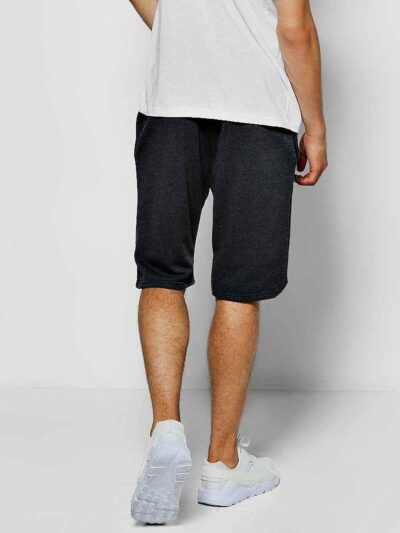 Close-up of soft French Terry gym shorts. Note loopback texture, durable stitching, adjustable drawstring waist. Athletic hea