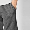 Close-up of soft French Terry gym shorts. Note loopback texture, durable stitching, adjustable drawstring waist. Athletic hea