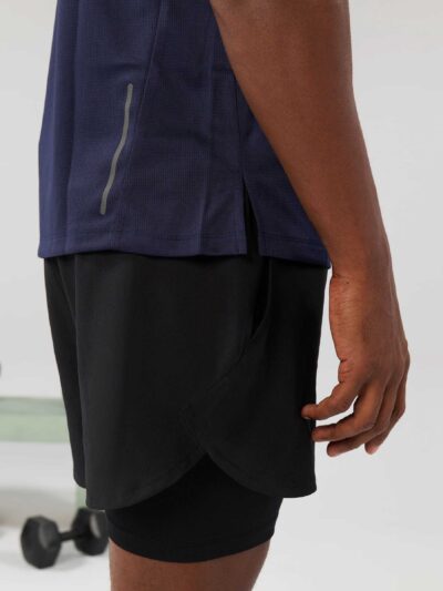 Men's high-end streetwear short set. Textured fabric, subtle stitching, tailored fit. Two-piece design, likely breathable mat