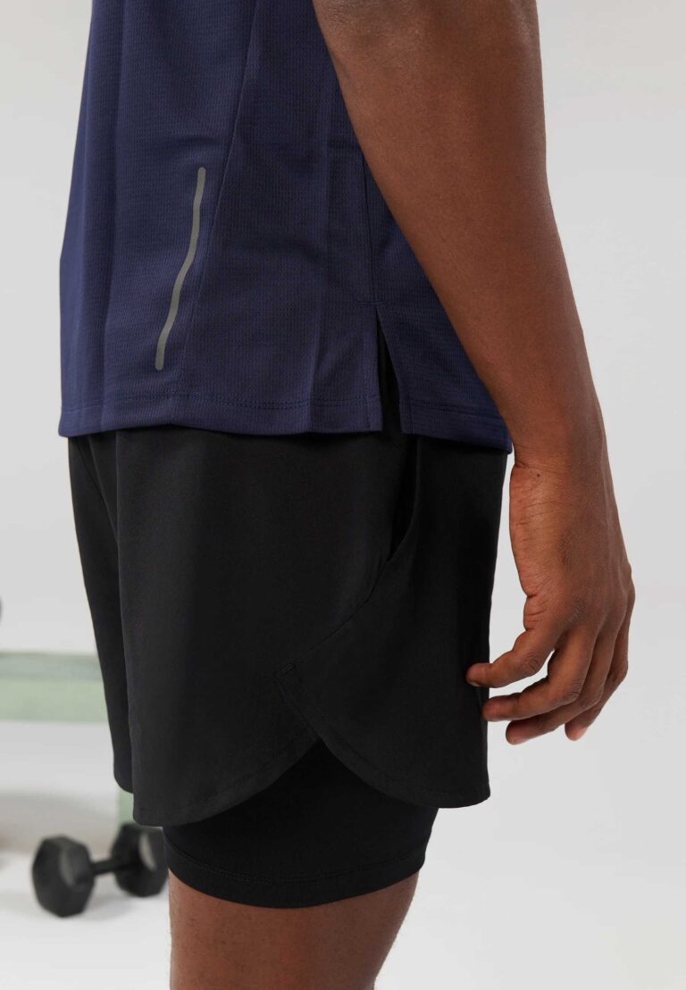Men's high-end streetwear short set. Textured fabric, subtle stitching, tailored fit. Two-piece design, likely breathable mat