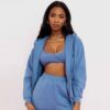 Ladies' athleisure tracksuit set. Gray heather knit, subtle reflective stripes. Cozy, relaxed fit. Fine stitching on jacket &