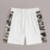 Oversized baggy streetwear shorts. Heavyweight cotton twill, visible stitching details. Neutral tone, industrial aesthetic. -