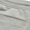 Performance athletic shorts, black with silver reflective trim. Close-up shows breathable, textured fabric and reinforced sti