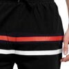 Close-up of custom printed sports shorts. Lightweight, breathable fabric with vibrant design. Quality stitching and comfortab