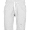 Close-up of athletic shorts fabric. Visible moisture-wicking weave, reinforced stitching. Performance garment in neutral gray
