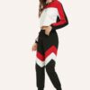 Stylish quarter zip top and contrast striped pants. Soft knit texture, clean stitching, subtle color accents on zip and strip