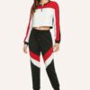 Stylish quarter zip top and contrast striped pants. Soft knit texture, clean stitching, subtle color accents on zip and strip