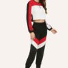 Stylish quarter zip top and contrast striped pants. Soft knit texture, clean stitching, subtle color accents on zip and strip