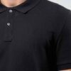 Close-up of a navy polo shirt. Smooth, breathable polyester with fine stitching. Custom logo printed sharply on the chest. -