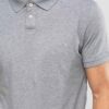 Close-up of a navy polo shirt. Smooth, breathable polyester with fine stitching. Custom logo printed sharply on the chest. -