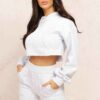 Heather gray crop hoodie with visible raw hem and intricate seam detailing. Soft, slightly textured fabric. Custom stitching