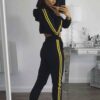 Cropped tracksuit in soft-touch knit fabric. Side stripe detail. Sporty-casual style with clean stitching, hints of vibrant c