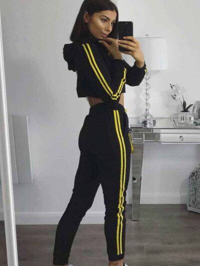 Cropped tracksuit in soft-touch knit fabric. Side stripe detail. Sporty-casual style with clean stitching, hints of vibrant c