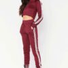 Cropped tracksuit in soft-touch knit fabric. Side stripe detail. Sporty-casual style with clean stitching, hints of vibrant c