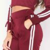 Cropped tracksuit in soft-touch knit fabric. Side stripe detail. Sporty-casual style with clean stitching, hints of vibrant c
