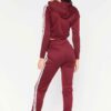 Cropped tracksuit in soft-touch knit fabric. Side stripe detail. Sporty-casual style with clean stitching, hints of vibrant c