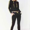 Cropped tracksuit in soft-touch knit fabric. Side stripe detail. Sporty-casual style with clean stitching, hints of vibrant c